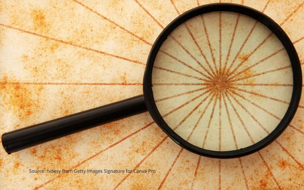 Magnifying glass showing the center of a starburst to illustrate identity and positive change.