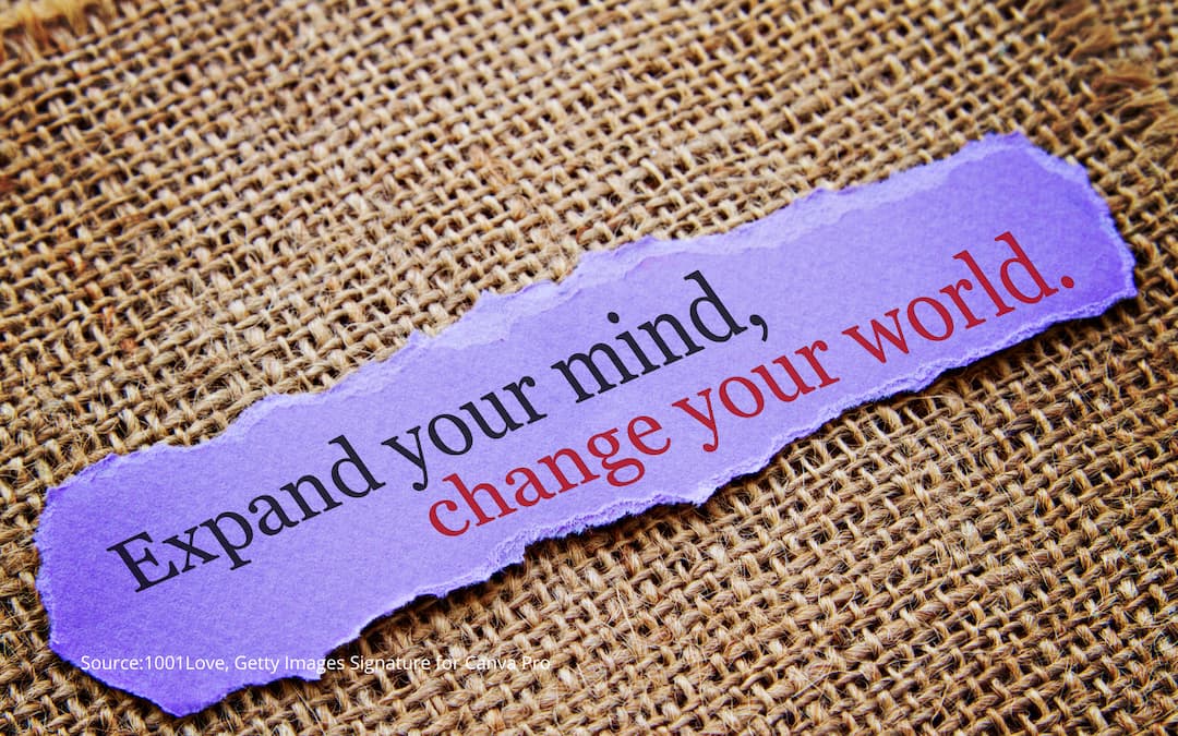 Torn paper with the text "expand your mind, change your world" to illustrate the process of raising your awareness of cultural expectation.